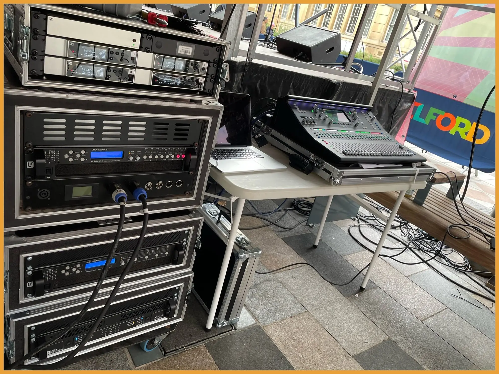 Linea Research amplifier racks set up beside a stage
