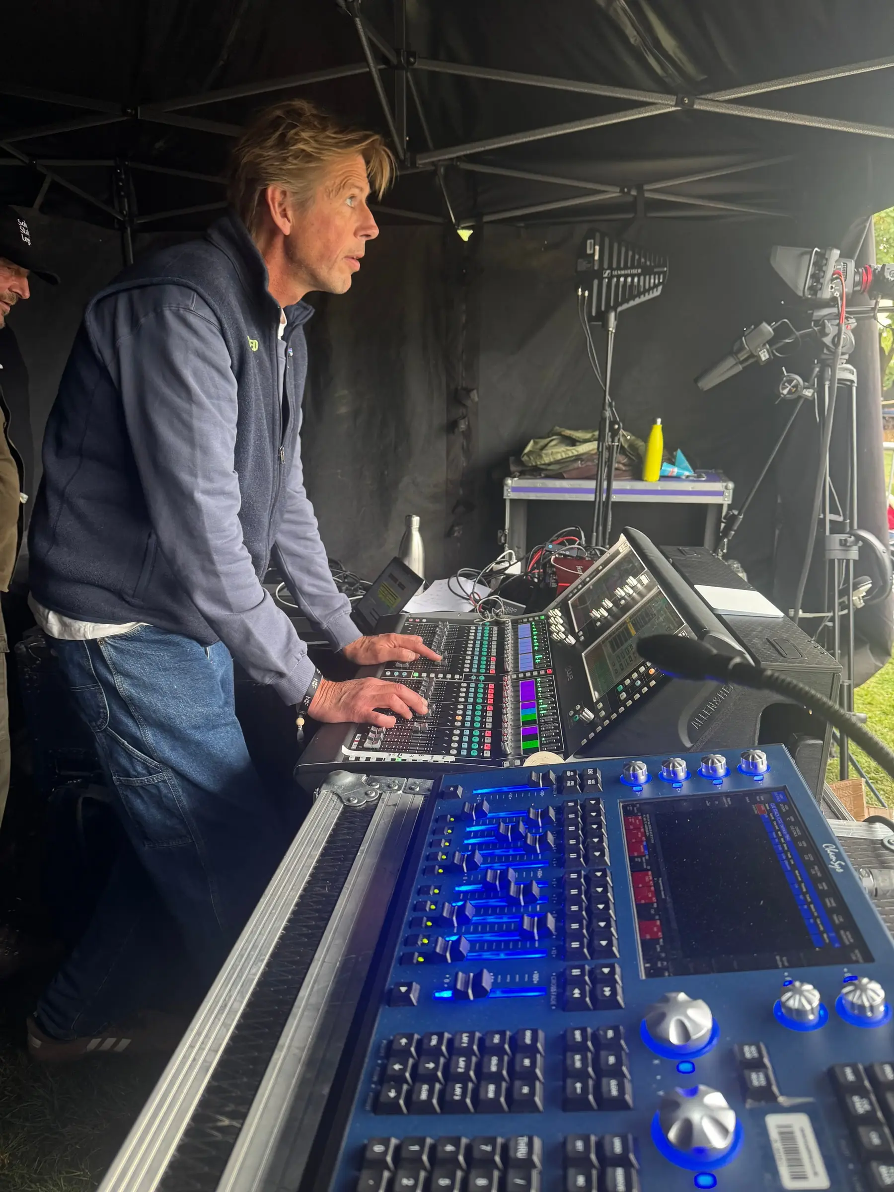 Andy Cato behind the Pioneer DJ equipment on stage