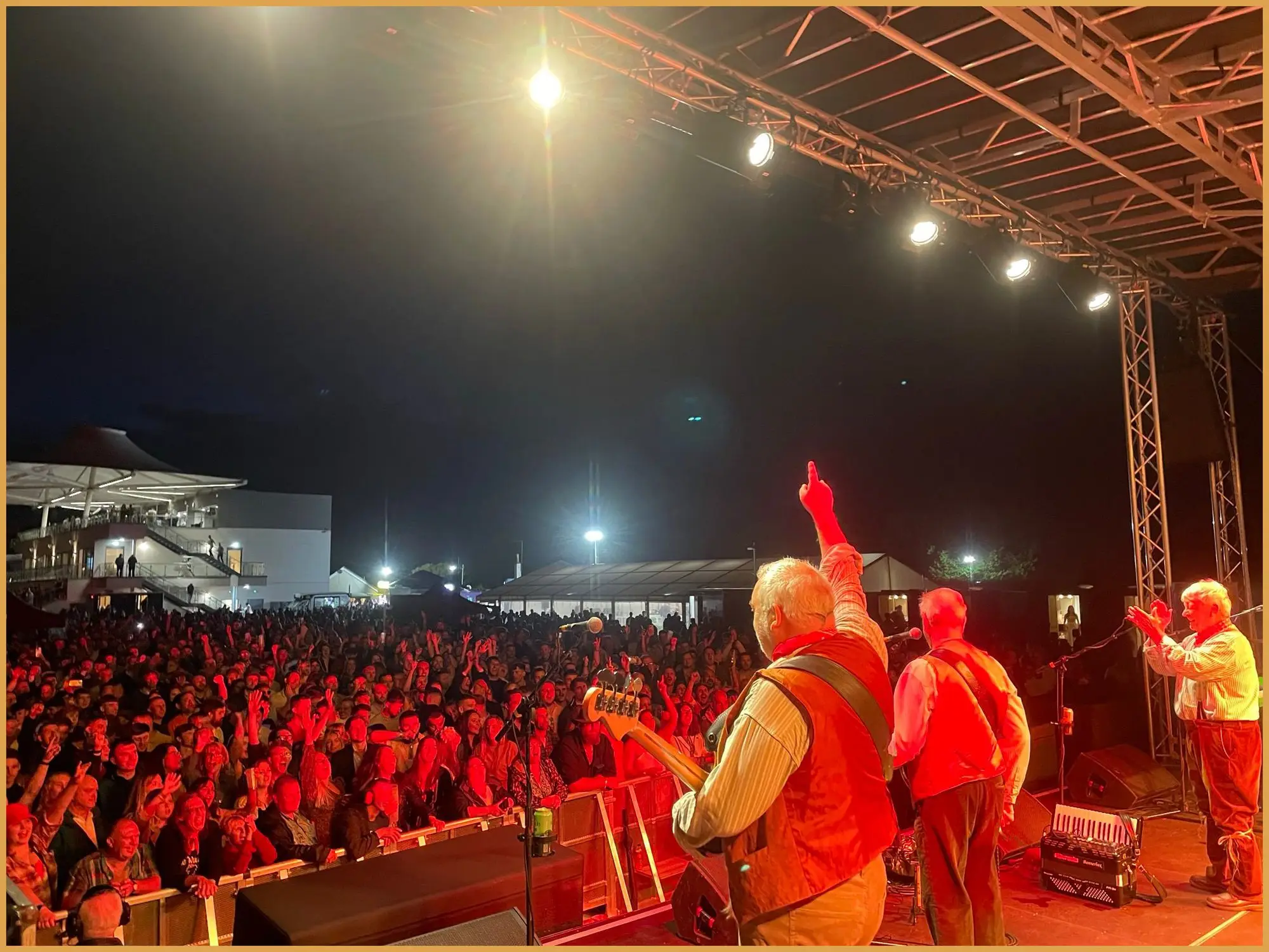 The Wurzels on stage in front of a packed crowd at Bath Racecourse