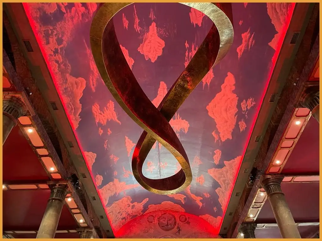 The painted ceiling of The Mount Without lit in red