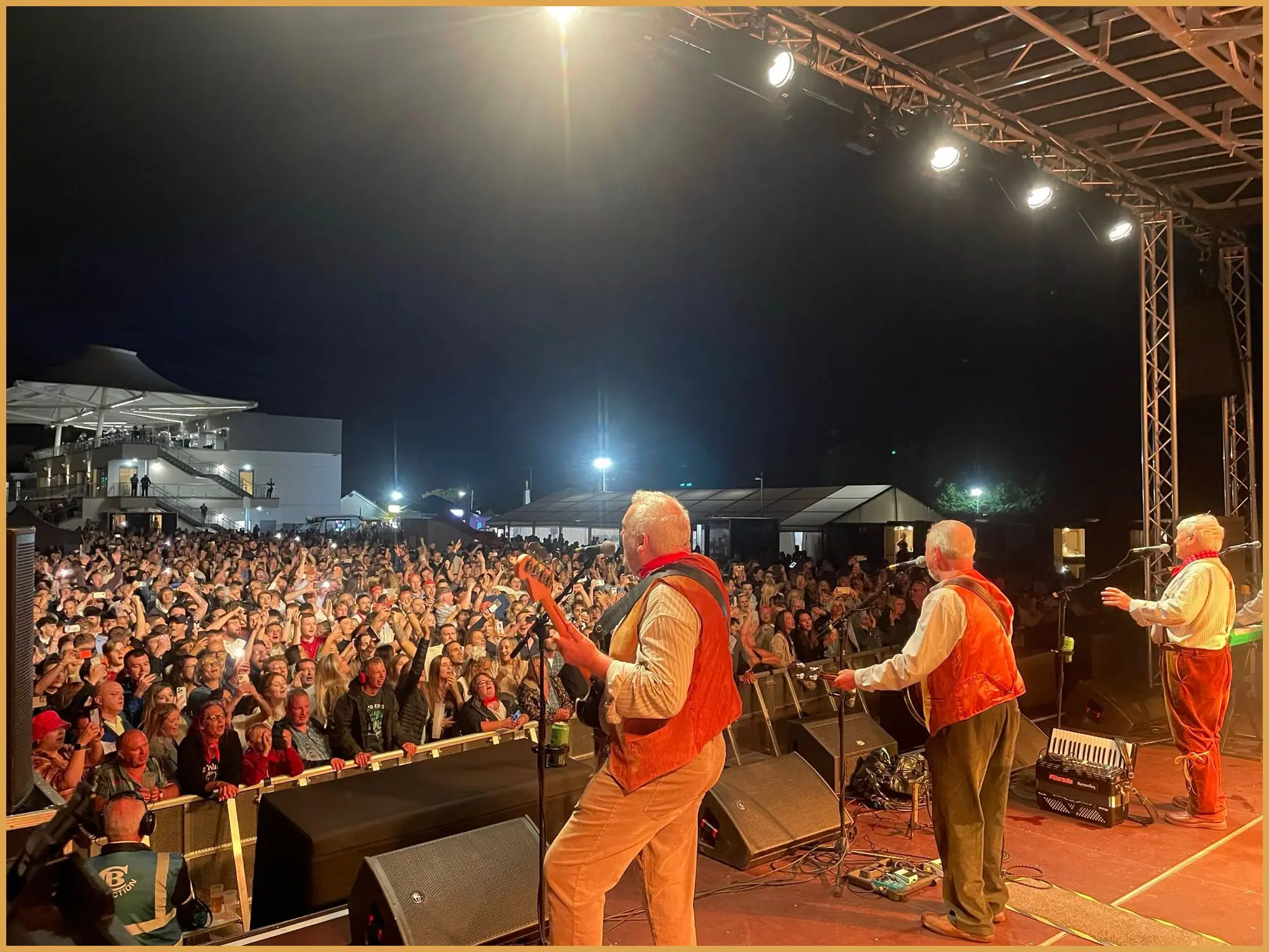 View from the stage of a crowd of thousands at Bath Racecourse as The Wurzels perform
