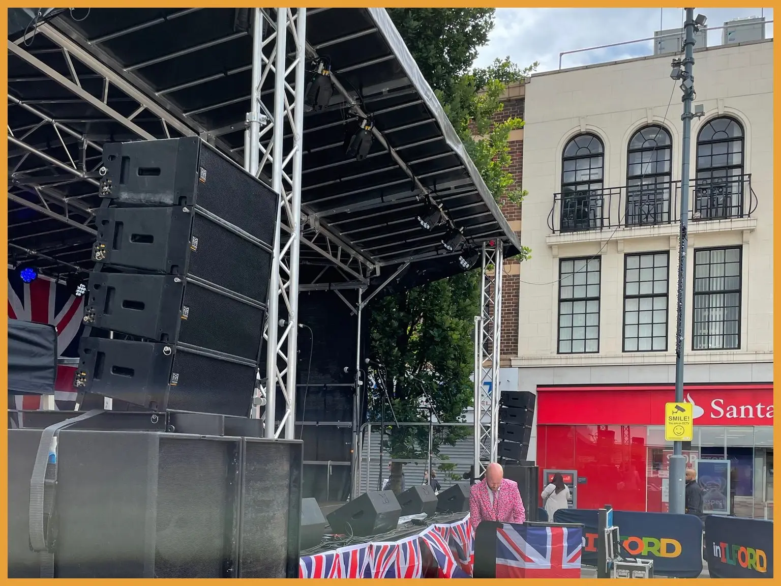 Crowd watching performers on the high street stage