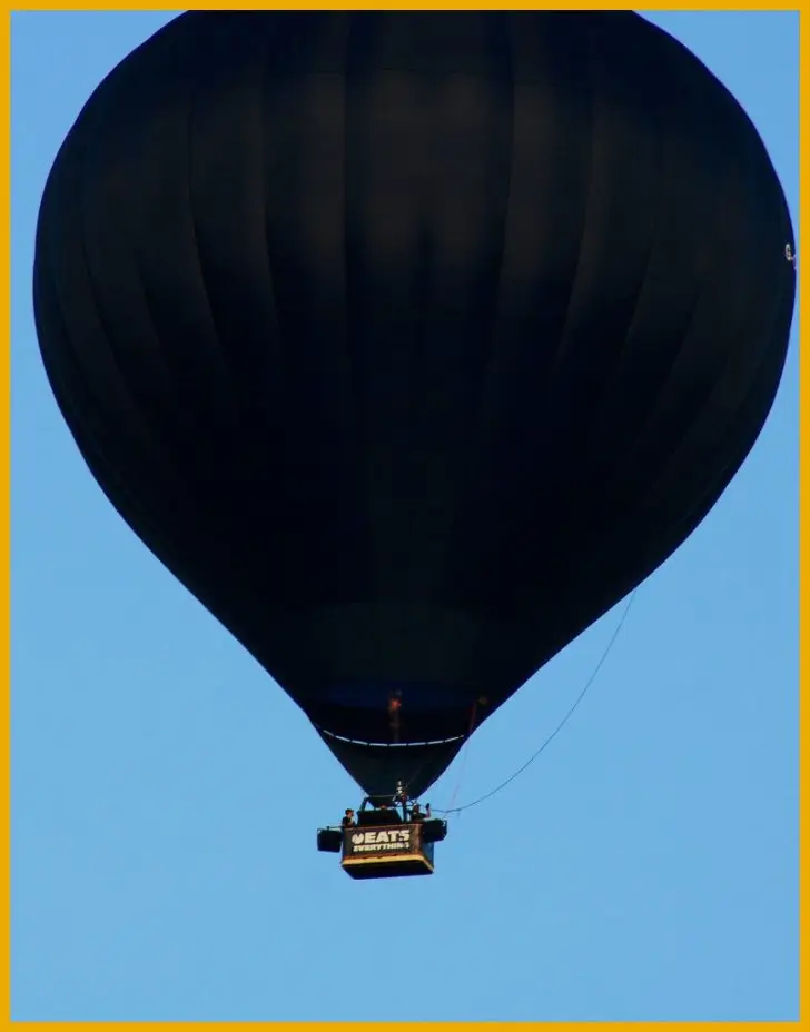 DJ playing from a hot air balloon basket at altitude
