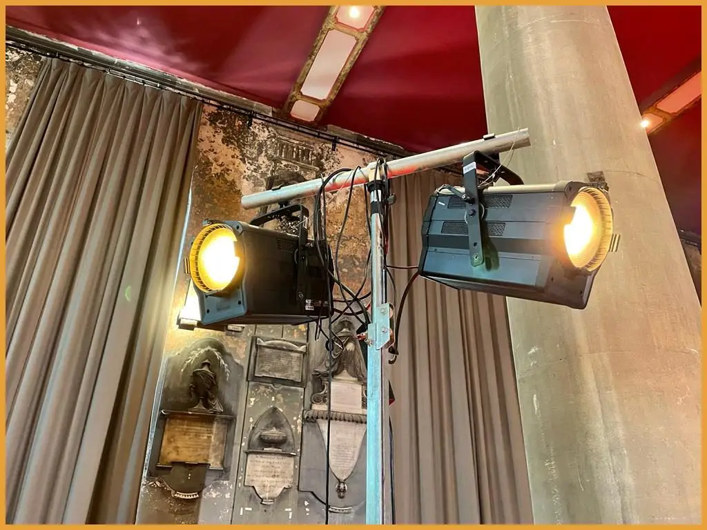 LED lighting fixtures rigged to the venue's stone pillars