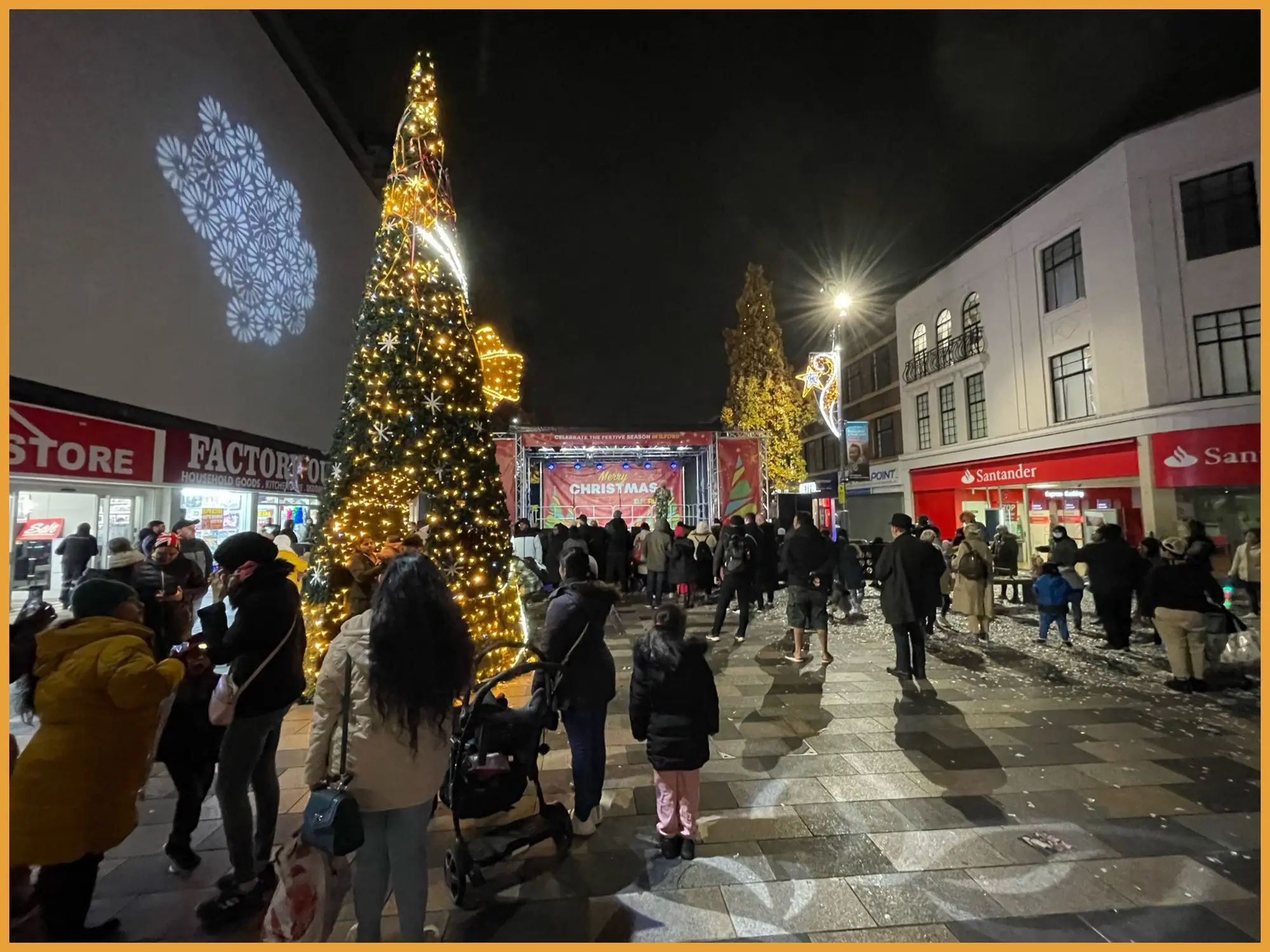 Ilford high street at night with the stage and Christmas lights
