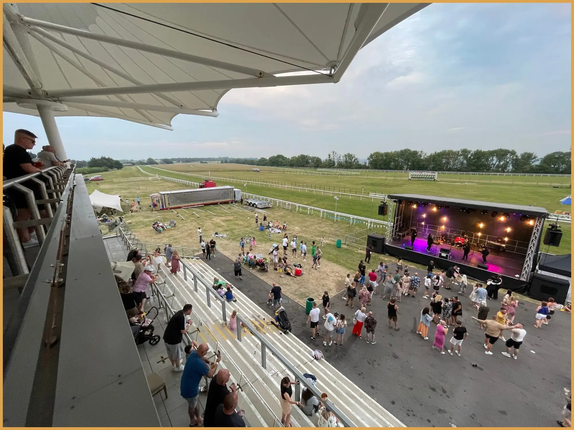 View of the stage and crowd from the racecourse grandstand