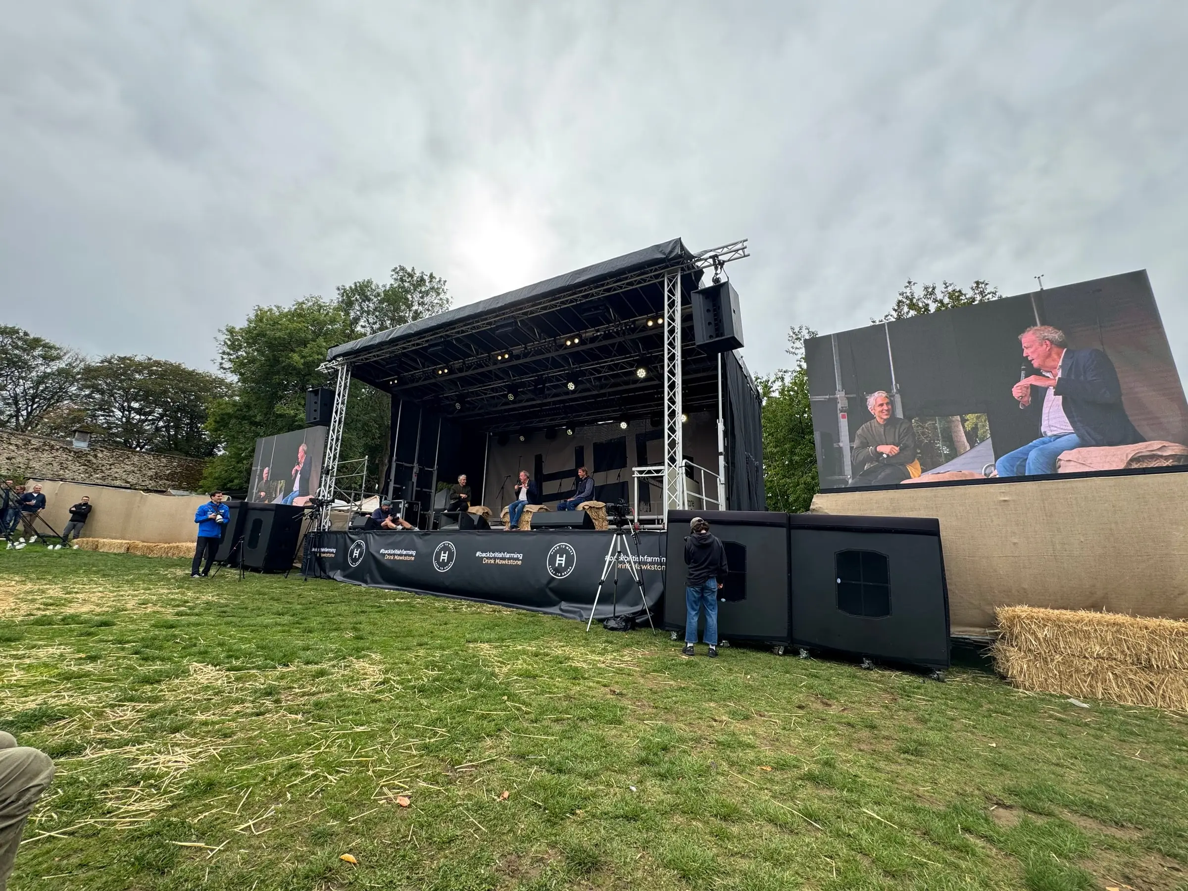 Panel discussion on the main stage shown on the adjacent LED screen
